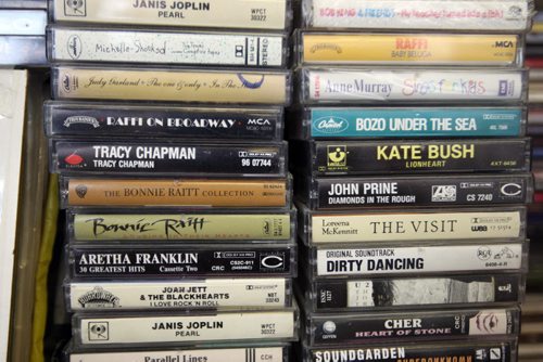 Jeff Bishop  owner of Sound Exchange, 557 Portage Ave -audio cassettes, which turned 50 years old last month. Bishop sells loads of cassettes to young hipsters who are looking for the next, old thing. With piles of cassettes that hipsters buy at a dozen at a time -See David Sanderson 49.8 story- Sept 18, 2013   (JOE BRYKSA / WINNIPEG FREE PRESS)