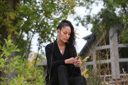 Edee O'Meara visits  a beautiful rental home  on Lake Winnipeg  near Misty Lake lodge Wednesday evening  that  was offered to her family to live in but with anticipated consequences.   See Alex Paul story on Lake St. Martin evacuee.  Sept  18,, 2013 Ruth Bonneville Winnipeg Free Press