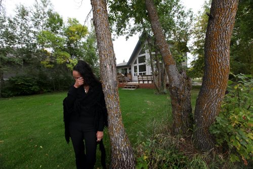 Edee O'Meara visits  a beautiful rental home  on Lake Winnipeg  near Misty Lake lodge Wednesday evening  that  was offered to her family to live in but with anticipated consequences.   See Alex Paul story on Lake St. Martin evacuee.  Sept  18,, 2013 Ruth Bonneville Winnipeg Free Press