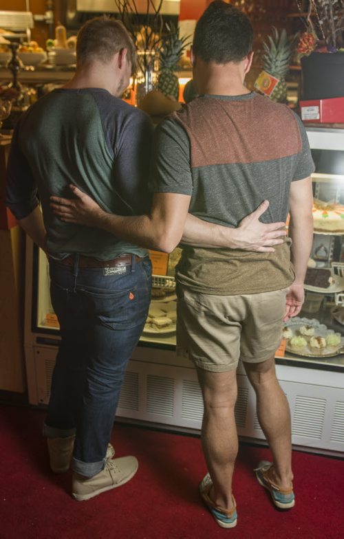 130918 Winnipeg - DAVID LIPNOWSKI / WINNIPEG FREE PRESS (September 18, 2013)  Jonathan Kindzierski (left) and Brett Owen (right) engaged in a kiss Wednesday September 18, 2013 at Dessert Sinsations Café.  For a story about homosexual public displays of affection.