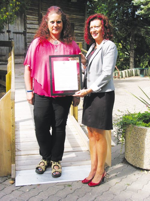 Canstar Community News Sept. 11, 2013 - Sandra Horyski (left) was pleased to receive a framed copy of the Member's Statement that MLA Sharon Blady (Kirkfield Park) read in the Manitoba Legislature to recognize Horyski's work in securing a memorial marker for her ancestor Cuthbert Grant. (ANDREA GEARY/CANSTAR COMMUNITY NEWS)