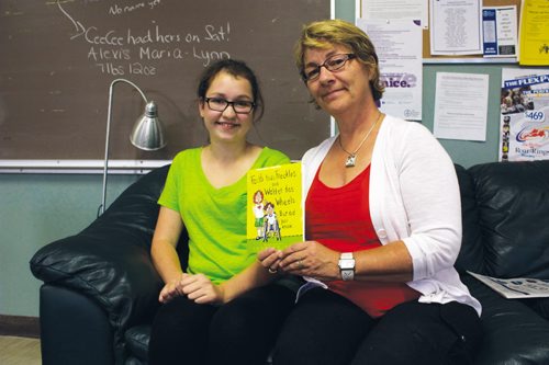 Canstar Community News Sept. 11, 2013 - River East Transcona School DIvision educational assistant Shannon Schultz. who authored Faith has Freckles and Walter has Wheels. But did you know... is shown with Murdoch MacKay Collegiate student Abby Turczak, who does readings of the book for young students. (DAN FALLOON/CANSTAR COMMUNITY NEWS/HERALD)