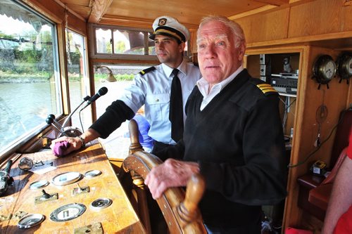 First Mate Glyn Thomas pilots the Paddlewheel Queen  while Joshua Starchuk, main deck hand, watches as it cruised the Red River for the last time this year. 130922 September 22, 2013 MIKE DEAL / WINNIPEG FREE PRESS