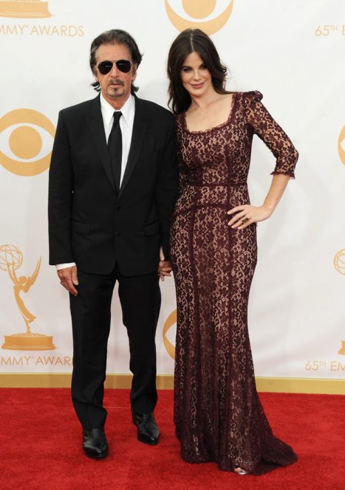 Al Pacino, left, and Lucila Sola arrive at the 65th Primetime Emmy Awards at Nokia Theatre on Sunday Sept. 22, 2013, in Los Angeles.  (Photo by Jordan Strauss/Invision/AP)