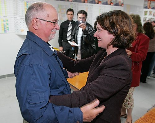 BORIS MINKEVICH / WINNIPEG FREE PRESS  070522 Manitoba Election. Erin Selby is congratulated by her dad Jim Selby at her Southdale headquarters.
