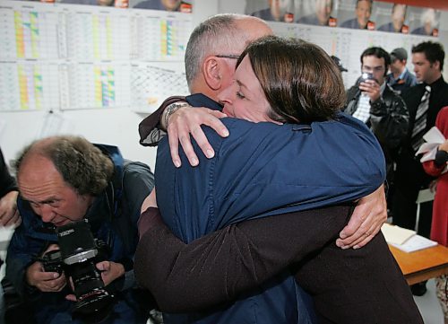 BORIS MINKEVICH / WINNIPEG FREE PRESS  070522 Manitoba Election. Erin Selby is hugger by her dad Jim Selby at her Southdale headquarters.