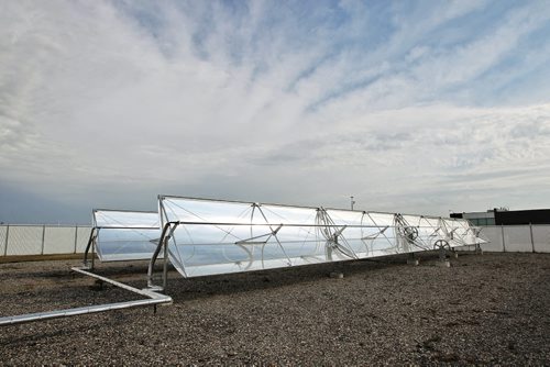 Red River College, Manitoba Hydro and the University of Manitoba have partnered together to develop a Solar Trough test site. The Solar Trough concentrates the suns energy to heat a fluid-filled tube. The test site can provide heat for up to 10 homes during the winter and it can produce enough energy to power 5000 LED light bulbs. The partners gathered at the site on the Red River College Notre Dame campus Monday morning to make the partnership official and to show off the Solar Tough.  130923 September 23, 2013 MIKE DEAL / WINNIPEG FREE PRESS