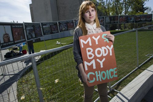 130921 Winnipeg - DAVID LIPNOWSKI / WINNIPEG FREE PRESS (September 23, 2013)  University of Manitoba Interior design student Ashley James is one of many U of M students taking a stand against a University of Manitoba Students Group -- Students For A Culture Of Life, that erected anti-abortion displays which are controversial and graphic on the U of M campus Monday afternoon.