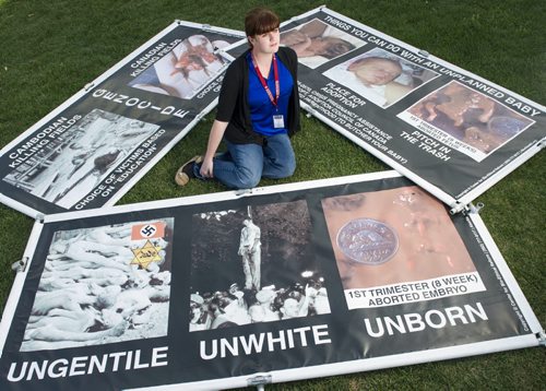 130921 Winnipeg - DAVID LIPNOWSKI / WINNIPEG FREE PRESS (September 23, 2013)  Vice President of the University of Manitoba Students Group -- Students For A Culture Of Life, Cara Ginter with anti-abortion displays which are controversial and graphic on the U of M campus Monday afternoon.