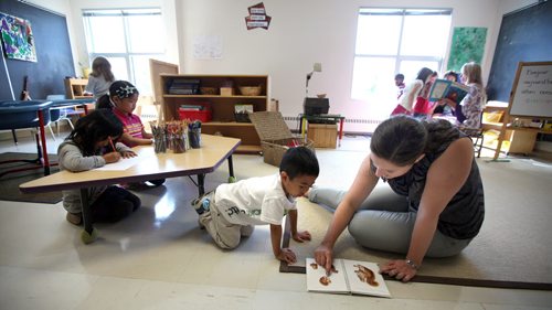 Kindergarten teacher Arielle Gaudet works with her French Immersion class at Edward Finney School Tuesday afternoon. See story. September 24, 2013 - (Phil Hossack / Winnipeg Free Press)