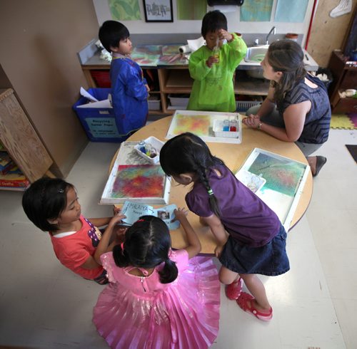 Kindergarten teacher Arielle Gaudet (top left) works with her French Immersion class at Edward Finney School Tuesday afternoon. See story. September 24, 2013 - (Phil Hossack / Winnipeg Free Press)