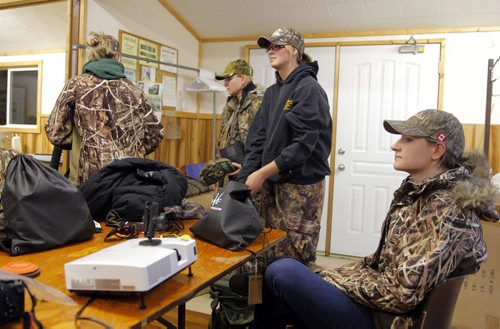 Manitoba Wildlife Federation's Women's waterfowl hunt. L-R Jacqueline Krause, Michelle Boschman, and Julie Gizella Kozachuk moments before the two groups take off for the hunt at 4:45am.  BORIS MINKEVICH / WINNIPEG FREE PRESS. Sept. 22, 2013