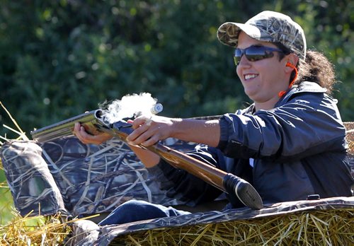 Manitoba Wildlife Federation's Women's waterfowl hunt.  Rena Nayer pops the shotgun shell out after shooting some clay targets. BORIS MINKEVICH / WINNIPEG FREE PRESS. Sept. 21, 2013