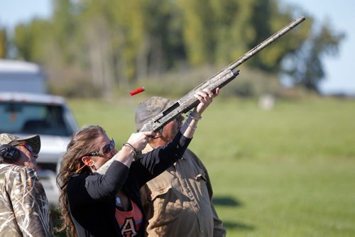 Manitoba Wildlife Federation's Women's waterfowl hunt. Women's waterfowl hunting weekend. Rebecca Tremeer is coached by shooting instructors Fred Tait, right, and Rob Wyton, far left. BORIS MINKEVICH / WINNIPEG FREE PRESS. Sept. 21, 2013
