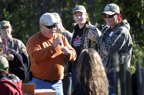Manitoba Wildlife Federation's Women's waterfowl hunt.  Mentor bird hunter Kerry Coleman shows Claire Mahoney, right, how to do some bird calls.  Middle behind woman is Julie Kozachuk. BORIS MINKEVICH / WINNIPEG FREE PRESS. Sept. 21, 2013