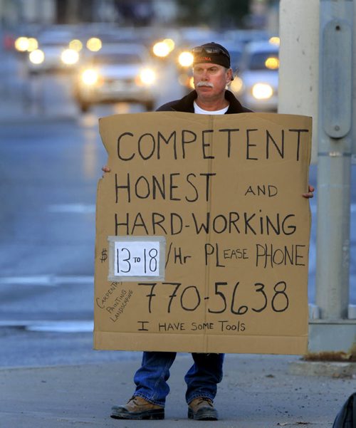 Tim takes his employment message to the streets Wednesday morning at the busy intersection of Portage Ave. and Broadway.  Wayne Glowacki / Winnipeg Free Press Sept. 25 2013