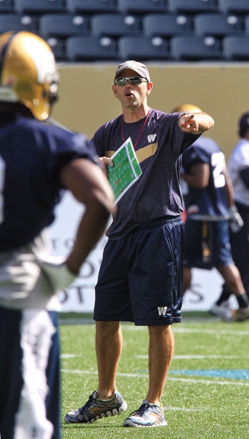 Winnipeg Blue Bombers Special Teams Coach, Craig Dickenson, directs the play during practice at Investors Group Field Wednesday afternoon. 130925 - September 25, 2013 MIKE DEAL / WINNIPEG FREE PRESS