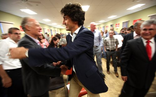 Justi Trudeau embraces outgoing provincial Liberal Leader Jon Gerrard in Lorette Wednesday evening. Trudeau spoke at a nomination meeting where Terry Hayward was acclaimed to run in Provencer. See story...September 25, 2013 - (Phil Hossack / Winnipeg Free Press)