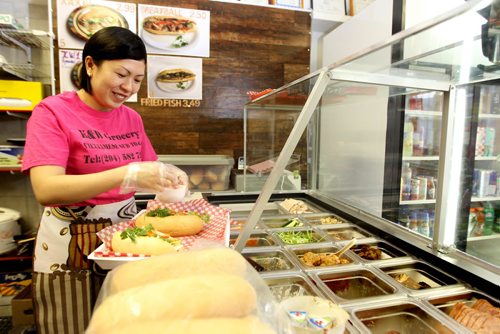 Trinh Le owner of K & W Grocery and Convenience  makes tasty, Vietnamese subs and sticky rice next to her grocery store on Dufferin.  Food Front. Sept  26,, 2013 Ruth Bonneville Winnipeg Free Press