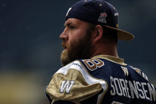 Practicing in the rain Äì Centre # 68 Justin Sorensen  is the centre of a revamped line looks ready during  walk through practice -  Wpg Blue Bombers prepare for BC Lions Friday night at Investors Stadium  KEN GIGLIOTTI / SEPT 26 2013 / WINNIPEG FREE PRESS