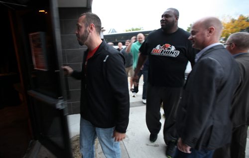 Buck Pierce leads his new team mates into his local eatery and bar Thursday night. Making his first appearance back in the Peg since being moved to the BC Lions. See story?  September 26, 2013 - (Phil Hossack / Winnipeg Free Press)