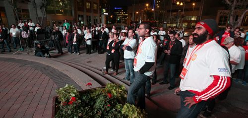 There but for the grace of.....Corporate executives listen to speeches Thursday evening at Portage and Main where he and other local executives are camped out for the CEO Sleepout 2013.  See story?  September 26, 2013 - (Phil Hossack / Winnipeg Free Press)