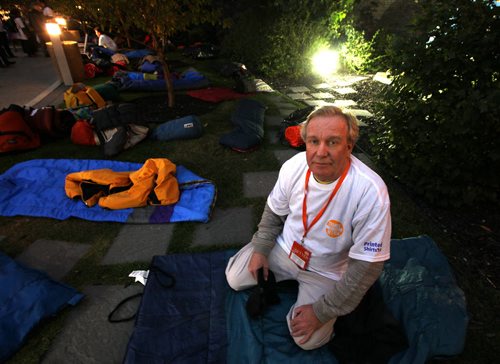 There but for the grace of.....Manitoba's Chief of Protocol Dwight MacAulay checks out his digs for the evening at Portage and Main where he and other local executives are camped out for the CEO Sleepout 2013.  See story?  September 26, 2013 - (Phil Hossack / Winnipeg Free Press)