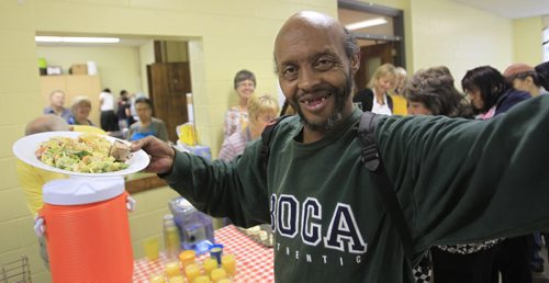 Faith Page story about the 125 year old Lutheran church at 265 Flora Ave. closes, leaves building to community for programming.  Simba with his plate of food at the Friday lunch - run by Secret Place Ministry in the building.    Brenda Suderman story Wayne Glowacki / Winnipeg Free Press Sept. 27 2013