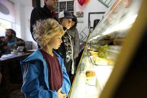 Seven year old Quinn Hudson tries to decide which sticky bun he is going to order at Jonnies Stick Buns Saturday afternoon. See story for more details.  Sept  28,, 2013 Ruth Bonneville Winnipeg Free Press