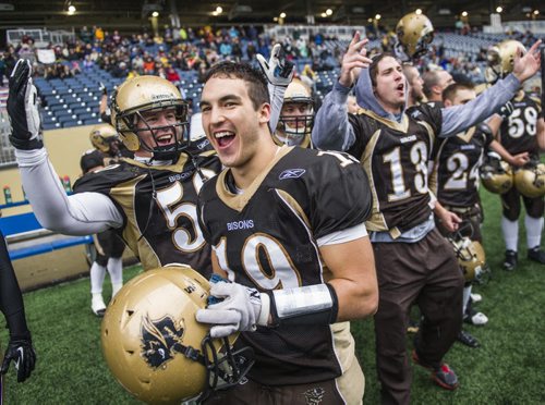 130928 Winnipeg - DAVID LIPNOWSKI / WINNIPEG FREE PRESS (September 28, 2013)  University of Manitoba Bisons celebrate their win over the University of Regina Rams at Investors Group Field Saturday afternoon. The Bisons defeated the Rams 34-15.
