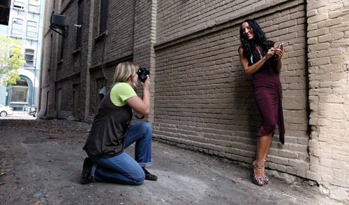 Kyra Lichtenstein (left) takes Joanne Amber's photograph in the Exchange District Sunday afternoon. They are part of a group called Snap Happy Winnipeg that took advantage of the nice weather to gather in the Exchange to photograph each other. 130929 - September 29, 2013 MIKE DEAL / WINNIPEG FREE PRESS