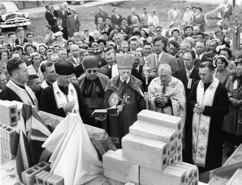 Winnipeg Free Press Archives August 11, 1952 Archbishop Basil Ladyka, (centre wearing a mitre and holding a cross) Sunday afternoon officiated at the blessing of a cornerstone to the new Ukrainian Catholic Holy Trinity church, Gonor, Manitoba. A number of priests took part in the morning service and the blessing, including Msgr. W. Kushnir, of the St. Vladimir and Olga cathedral, next to the archbishop on the right, and Father V. Bozyk, pastor of the Gonor congregation. Following the service a community dinner was held in the parish hall.