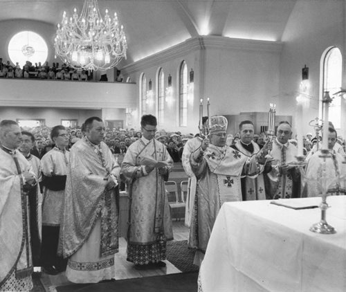 Winnipeg Free Press Archives June 21, 1958 Archbishop Maxim Hermaniuk pronounces his blessing at a service marking the opening of the new $250,000 St. Andrew's Ukrainian Catholic church at Euclid Avenue and Maple Street. To his right are Father J. Rudachek, and Msrg. Basil Kushnir, and on the left are Father M. Darevish and Father A. Wynnyk.