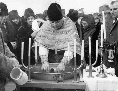 Winnipeg Free Press Archives January 25, 1963 An ancient Ukrainian religious custom was marked last weekend at the Ukrainian Orthodox Cathedral of St. Mary the Protectress, 820 Burrows Avenue. The rector, Rev. Ivan Stus, celebrates the Feast of the Epiphany which, according to the Julian calendar, occurred January 19 in the third century when the birth of Christ was introduced as a Christian holy day. Rev. Stus performs the blessing of the water, commemorating Christ's baptism. The ceremony is performed in all Ukrainian orthodox churches.