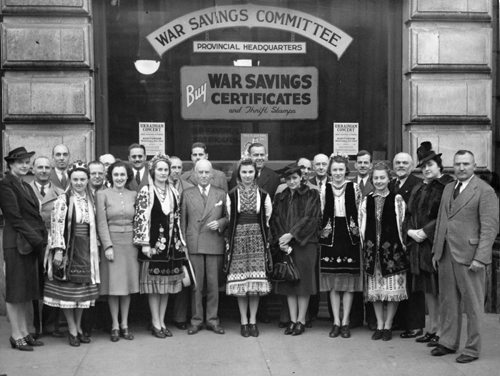 Winnipeg Free Press Archives October 19, 1940 To raise funds for carrying on the battle Winnipeg Ukrainians are staging a war savings concert at the civic auditorium at 8:30 p.m., Wednesday, October 23. Seen in this photo are some of the performers and the war savings committee. Those taking part will include the Topper male quartet, radio artists, the Dizzy Dozen, also heard on the air; the CBC Harmonettes, and Luba Novnk, Constance Stefanik, Donna Grescoe and Joan Maraz, concert artists, Ukrainian folk dances will afford opportunities for the display of gorgeous national costumes and the Ukrainian choir and Ukrainian orchestra will present several numbers.