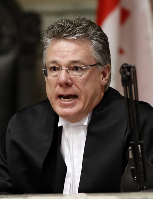 in pic MB. Court of Appeal judge  Richard Chartier - Stdup -attends  Province of Manitoba Court of Queen's Bench swearing -in   ceremony for Justice  Gwen Hatch  and Justice Sheldon Lanchbery in courtroom 210 of the Law Courts   KEN GIGLIOTTI / SEPT 30 2013 / WINNIPEG FREE PRESS