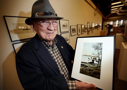 Joseph Keeper, who was born in Norway House holds a photo taken by Mary Bruce in the Manitoba Community on the East SHore of Lake WInnipeg between 1929 and 1032 when she was a "Matron" at the residential School located there. An exhibition of her work was unveiled at the U of W Archives as part of Artsfest 2013. (See release) Joseph is the father of Tina Keeper, and his father was one of two aborigionals who competed in the 1912 Olympics and placed in the 10,000 meter run. He's holding a hand painted photo of two canadian air force Vickers amphibious aircraft in the community. He remembers seeing the planes there regularly. STAND UP  Sept 30, 2013 - (Phil Hossack / Winnipeg Free Press)