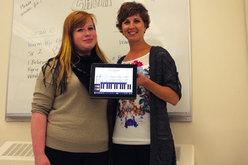 Canstar Community News Sept. 18, 2013 - River East Collegiate choral director Nicole Ens shows off her composition of the Gershwin tune Iíve Got Rhythm on her iPad alongside Grade 12 student Maria Andersson. (DAN FALLOON/CANSTAR COMMUNITY NEWS/HERALD)