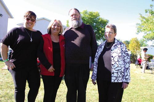 Canstar Community News The Willow Park East Housing Co-op celebrated the burning of its mortgage Saturday evening at its location on Tyndall Avenue with live music, kids' activities and a pig roast.  From left: Tammy Robinson, Manitoba manager with Co-operative Housing Federation of Canada; Linda Campbell, aboriginal director with CHFC; Brian Burch, director of CHFC; and Linda Ferguson, director, Manitoba region, with CHFC.