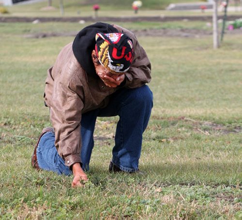 Faron Hall gets emotional at his uncle Wilson grave #345 in Brookside Cemetery- Because no family was located when he died he was buried in a numbered grave plot- Farron was in jail when he passed away-See Gordon Sinclair story- Oct 02, 2013   (JOE BRYKSA / WINNIPEG FREE PRESS)