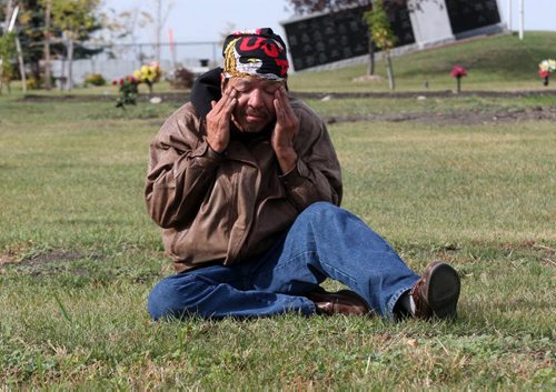 Faron Hall gets emotional at his uncle Wilson grave #345 in Brookside Cemetery- Because no family was located when he died he was buried in a numbered grave plot- Farron was in jail when he passed away-See Gordon Sinclair story- Oct 02, 2013   (JOE BRYKSA / WINNIPEG FREE PRESS)