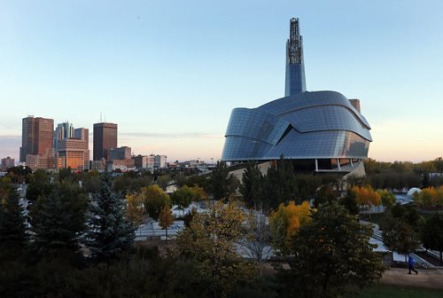 STDUP- Bright Orange Sunrise reflecting the fall colours on the Winnipeg s downtown skyline including the Candian Museum for Human Rights  KEN GIGLIOTTI / Oct. 3 2013 / WINNIPEG FREE PRESS CMHR