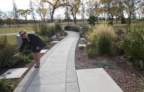 Jane Saxby, who manages the citys cemeteries  at St. Vital municipal cemetery that has the oldest Living Garden The cremation garden offers people many options for the interment of cremated remains.- See Randy Turner story- Oct 03, 2013   (JOE BRYKSA / WINNIPEG FREE PRESS)
