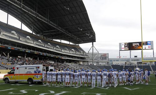 The UBC Thunderbirds' crowd to show their support Miguel Barker, who lay injured on the field for about 30 minutes before being taken away in an ambulance during their game at against the University of Manitoba Bisons' at Investors Group Field, Saturday, October 5, 2013. (TREVOR HAGAN/WINNIPEG FREE PRESS)