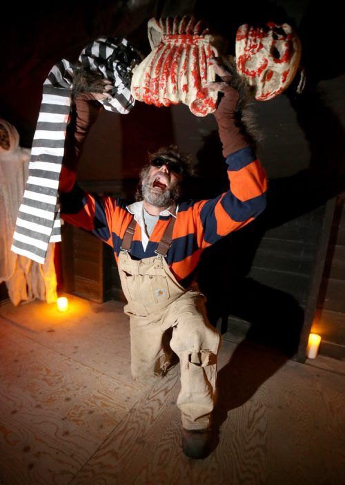 James Thevenot, owner of Six Pines Ranch, doing a dead lift in their haunted house, Saturday, October 5, 2013. (TREVOR HAGAN/WINNIPEG FREE PRESS) - for ashley prest training basket