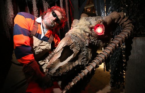 James Thevenot, owner of Six Pines Ranch, showing his strength as he wrestles with "Shirley" a giant monster in their haunted house, Saturday, October 5, 2013. (TREVOR HAGAN/WINNIPEG FREE PRESS) - for ashley prest training basket