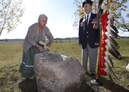 October 6, 2013 - 131006  - Elder Thelma Orvis blesses a monument  to Sgt Tommy Prince with Donald Mackey after an unveiling it during a monument re-dedication memorial service at Sgt Tommy Prince Veterans Park Sunday, October 6, 2013. John Woods / Winnipeg Free Press