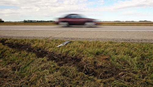 A gouge in the earth along the Trans-Canada Highway about two kilometers west of MacGregor, Manitoba, is all that marks the spot where a 17-year-old teen from Austin and a 14-year-old teen from Sidney died when a pickup truck slammed into the rear of the car they were driving in on Saturday at about 4 pm. 131006 October 06, 2013 Mike Deal / Winnipeg Free Press