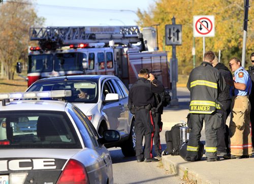 Winnipeg Police and Fire Paramedics at the scene on Pandora Ave. West near Plessis Rd. Monday morning where a woman was struck by a vehicle and transported to the hospital. Wayne Glowacki / Winnipeg Free Press Oct. 7