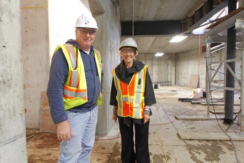 Living Water Columbarium's Monique Gauthier poses with construction site manager Phil Day at the new Catholic Church being built across from the Costco on Keniston. BORIS MINKEVICH / WINNIPEG FREE PRESS. Oct. 4, 2013